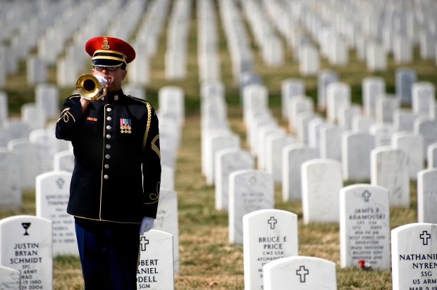 090311-N-0696M-097 A lone U.S. Army bugler plays Taps at the conclusion of the First Annual Remembrance Ceremony in Dedication to Fallen Military Medical Personnel at Arlington National Cemetery,  March 11, 2009.(DoD photo by Mass Communication Specialist 1st Class Chad J. McNeeley/Released)